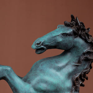 Close-up detail of azure blue bronze rearing stallion sculpture head and neck texture