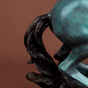 Close-up detail of azure blue bronze rearing stallion sculpture mane and tail showing dark texture