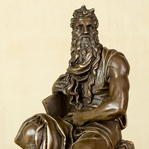 Close-up front view of Moses bronze statue showing intricate facial expression and robe details