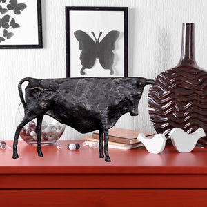 Small black abstract Picasso-inspired bull sculpture.