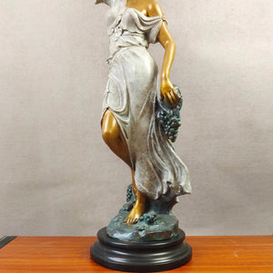 Pomona goddess bronze statue right side view on white background displaying grape vine details and marble base