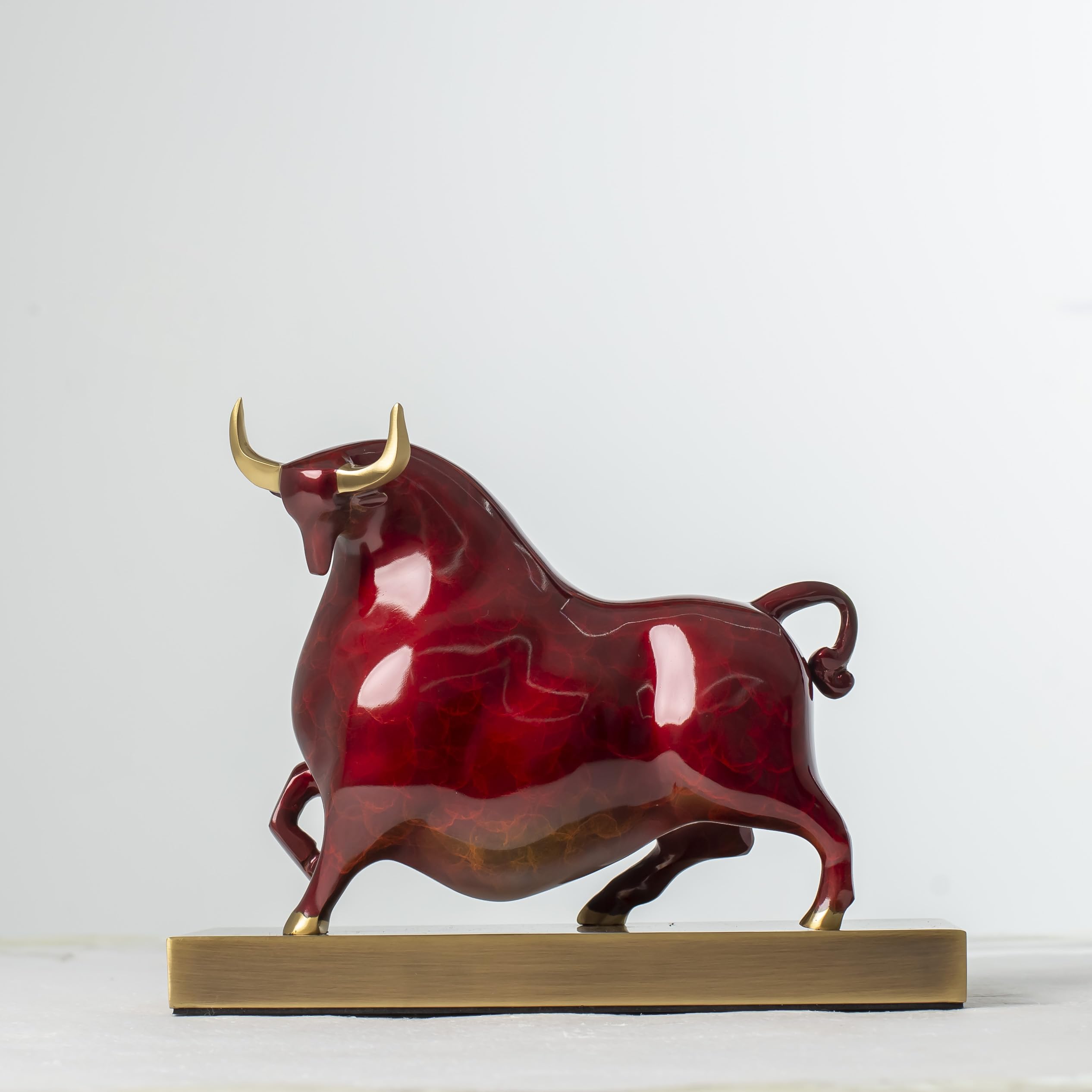 Handcrafted red enamel Wall Street bull statue, front view.