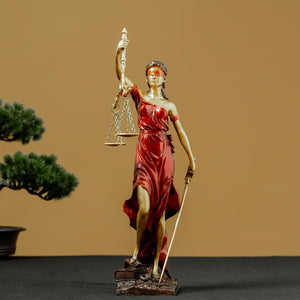 Red Lady Justice Themis statue displayed alongside bonsai tree in elegant lifestyle setting