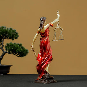 Second view of red Lady Justice Themis statue with bonsai tree in elegant indoor lifestyle decor