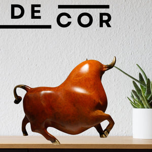 Detailed view of the mottled patina finish on reddish-orange bull