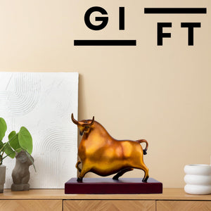 Artistic mottled patina texture of reddish-orange bull sculpture.