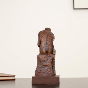 Back view of Rodin The Thinker classical bronze statue showing detailed sculpting and square base