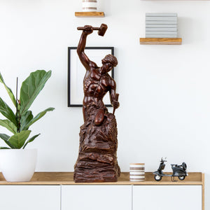 Close up of Self-Made Man statue in red-brown finish, size 47cm