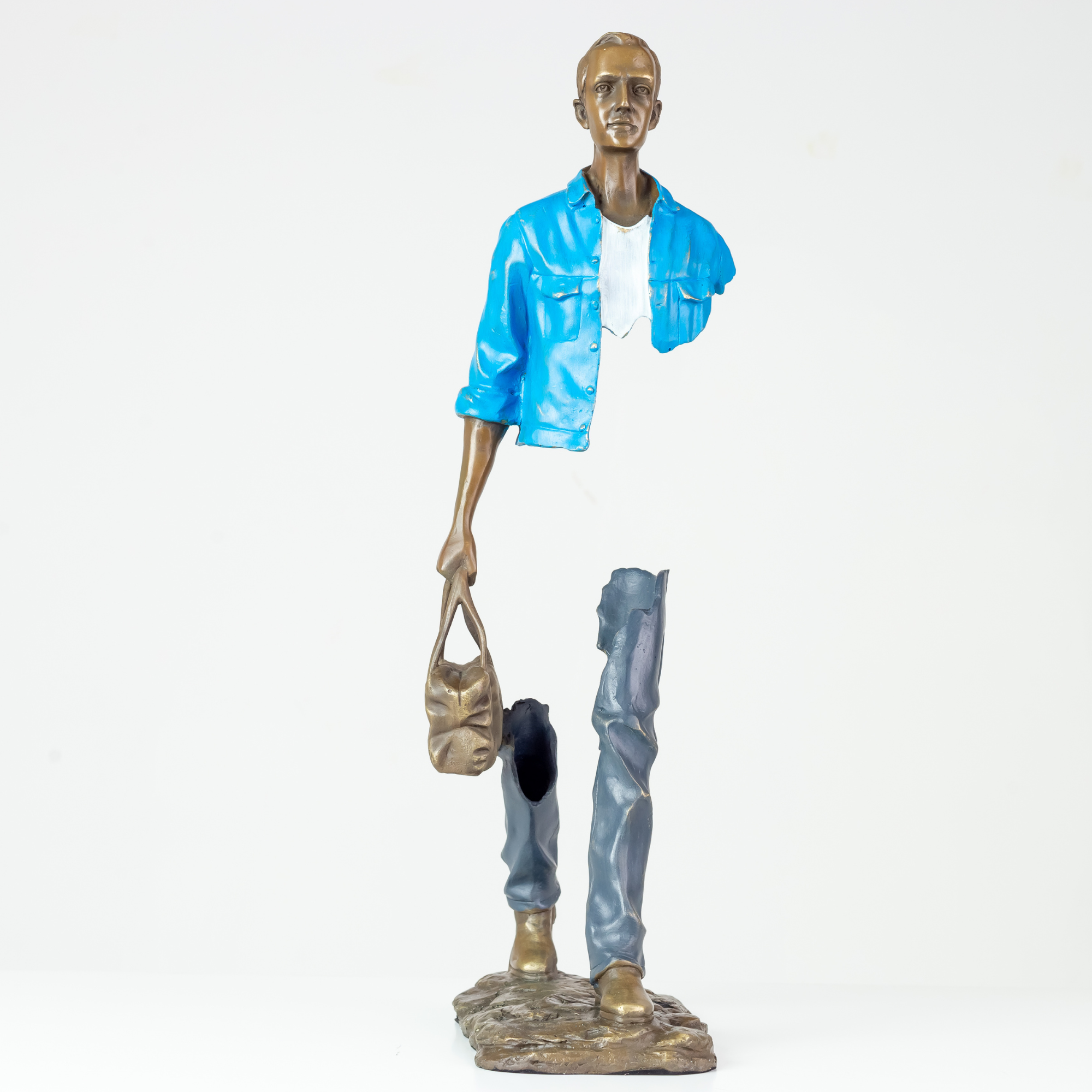 Front view of the 22-inch traveler bronze sculpture featuring a vibrant sky light blue jacket.
