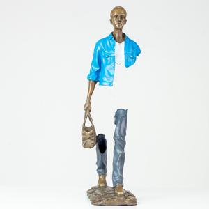Front view of the 22-inch traveler bronze sculpture featuring a vibrant sky light blue jacket.