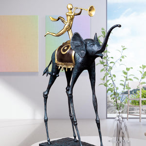 Dali-inspired surrealist bronze elephant statue displayed outdoors against blue sky backdrop