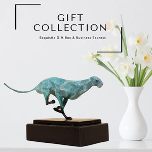 Teal azure running cheetah sculpture presented as gift collection in lifestyle setting
