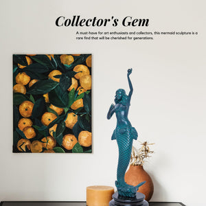 Teal blue bronze mermaid sculpture displayed in bright interior showing height reference