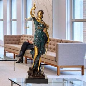Teal and gold Lady Justice Themis statues displayed alongside bonsai tree in elegant lifestyle setting