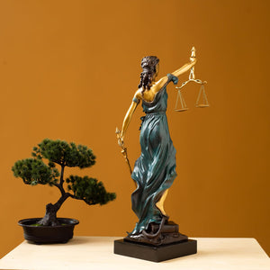 Teal bronze Lady Justice Themis statue in modern office with floor-to-ceiling window interior display