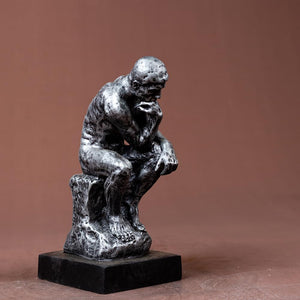 The Thinker gothic silver bronze statue left three-quarter angle view showing detailed seated pose