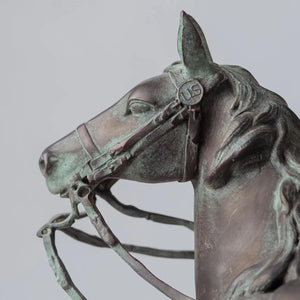 Base detail of Ulysses S. Grant bronze equestrian statue showing inscription plate and rectangular bronze base