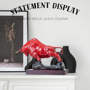 Handcrafted red patina charging bull art, side angle display.