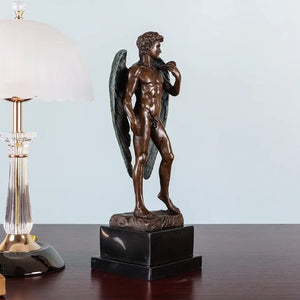 Back view of winged David bronze statue showing detailed feathered wings and sculptural texture