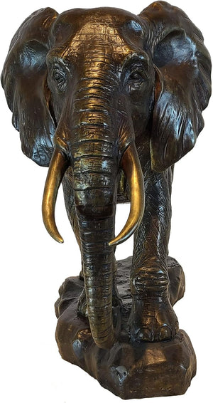 Close-up front view of African elephant bronze statue showing detailed head, tusks, and trunk