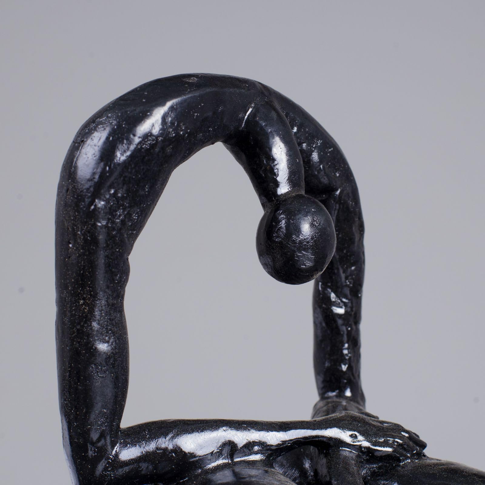 Albert György melancholy man bronze sculpture arched pose side view black finish