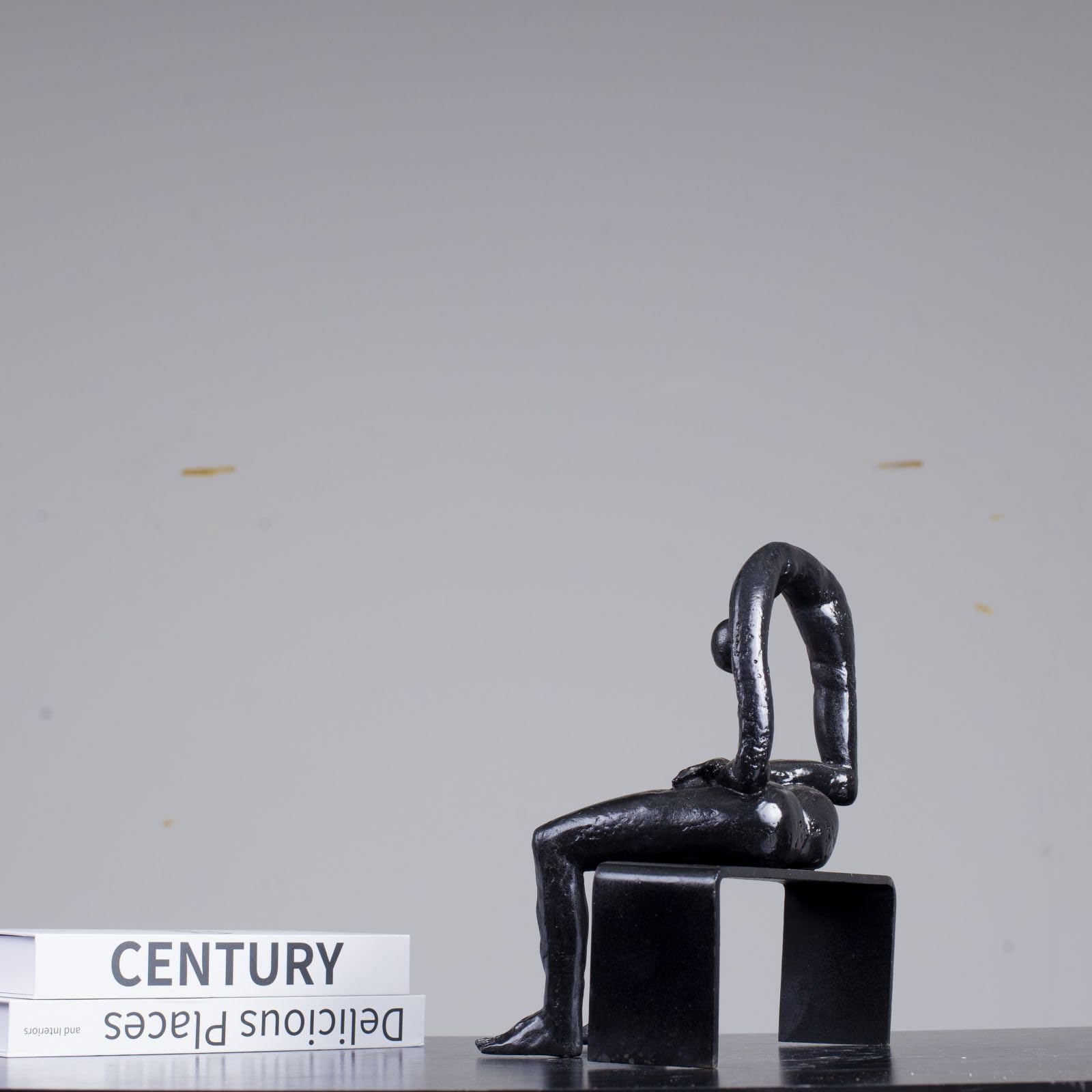 Albert György melancholy man bronze sculpture black finish back view detail