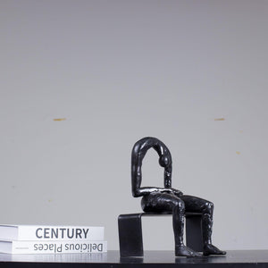 Albert György melancholy man bronze sculpture hunched pose back detail close up