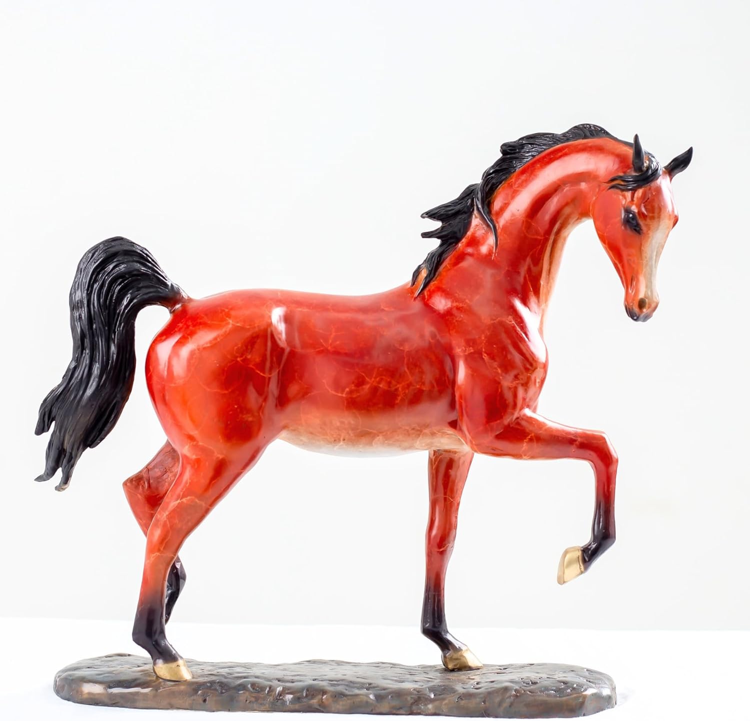 Arabian horse bronze sculpture front view showing detailed mane and stallion pose on black base