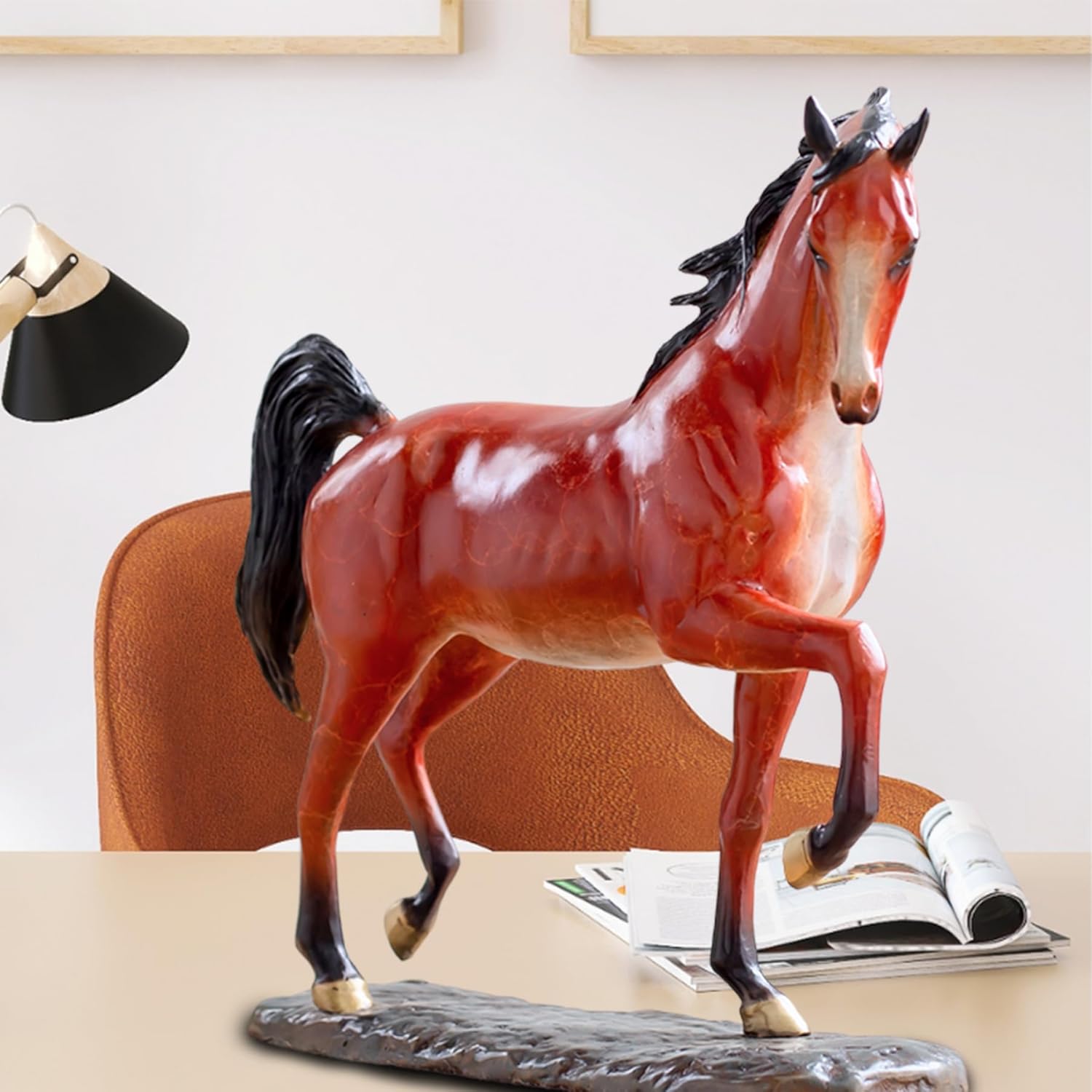 Arabian horse bronze sculpture displayed on wooden side table beside lamp in modern interior