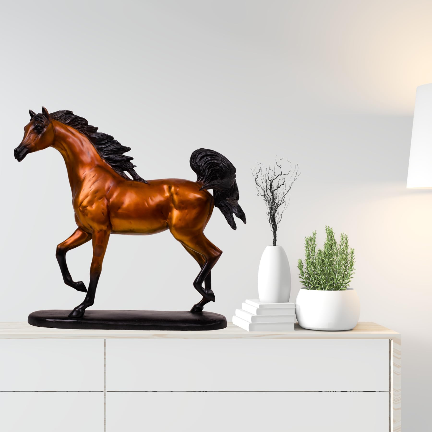 Chestnut amber Arabian stallion bronze sculpture displayed on cabinet beside vase and decor items