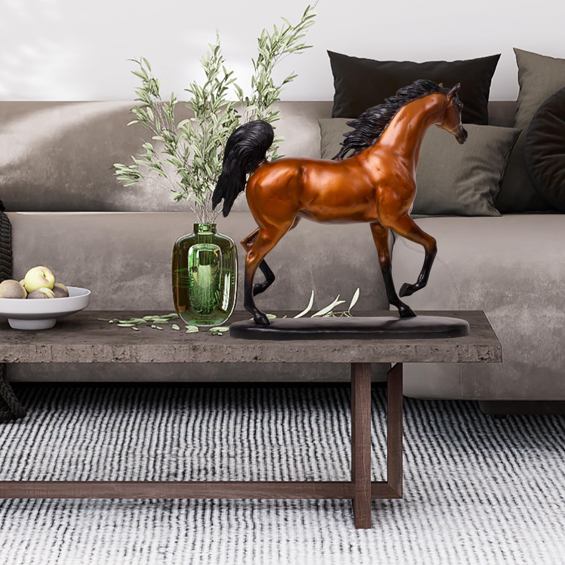 Chestnut amber Arabian stallion bronze sculpture displayed on coffee table beside sofa in living room