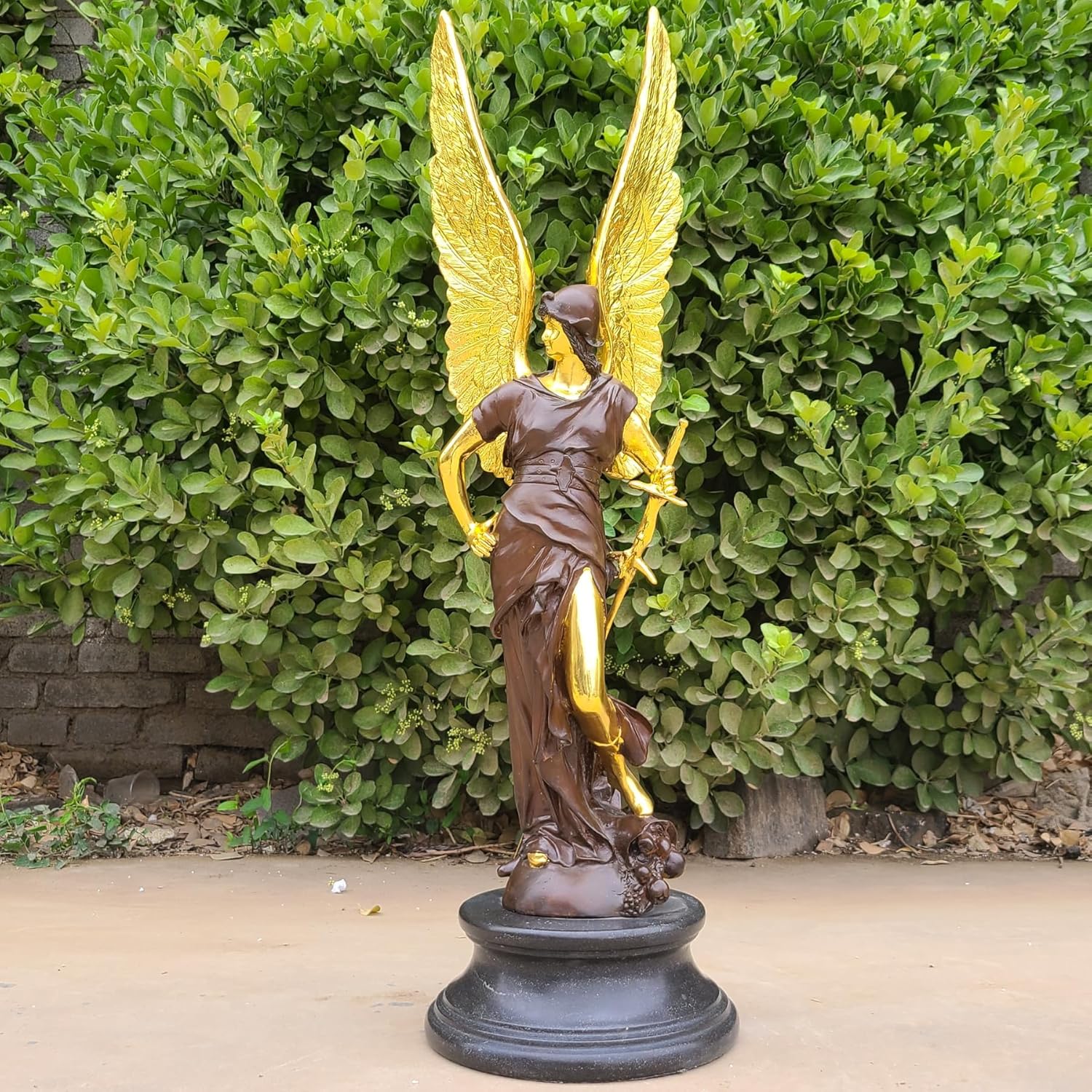 34-inch Athena bronze sculpture with gold angel wings, front view in outdoor garden setting