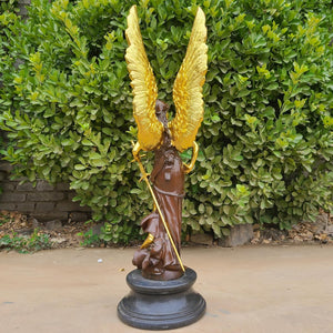 Full side view of Athena angel wings bronze sculpture showing gold wing span and figure detail