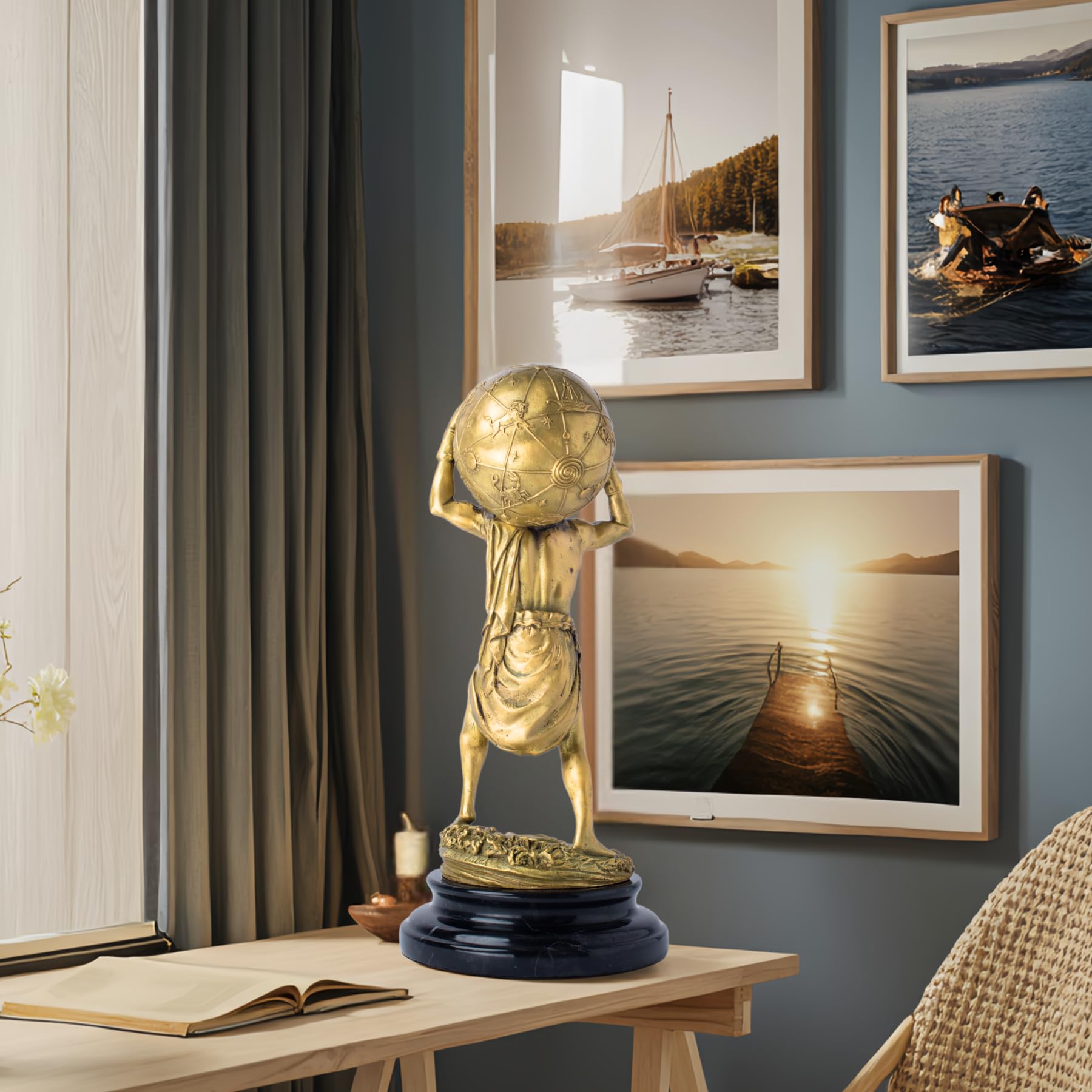 Atlas bronze sculpture gold finish living room display beside framed wall art