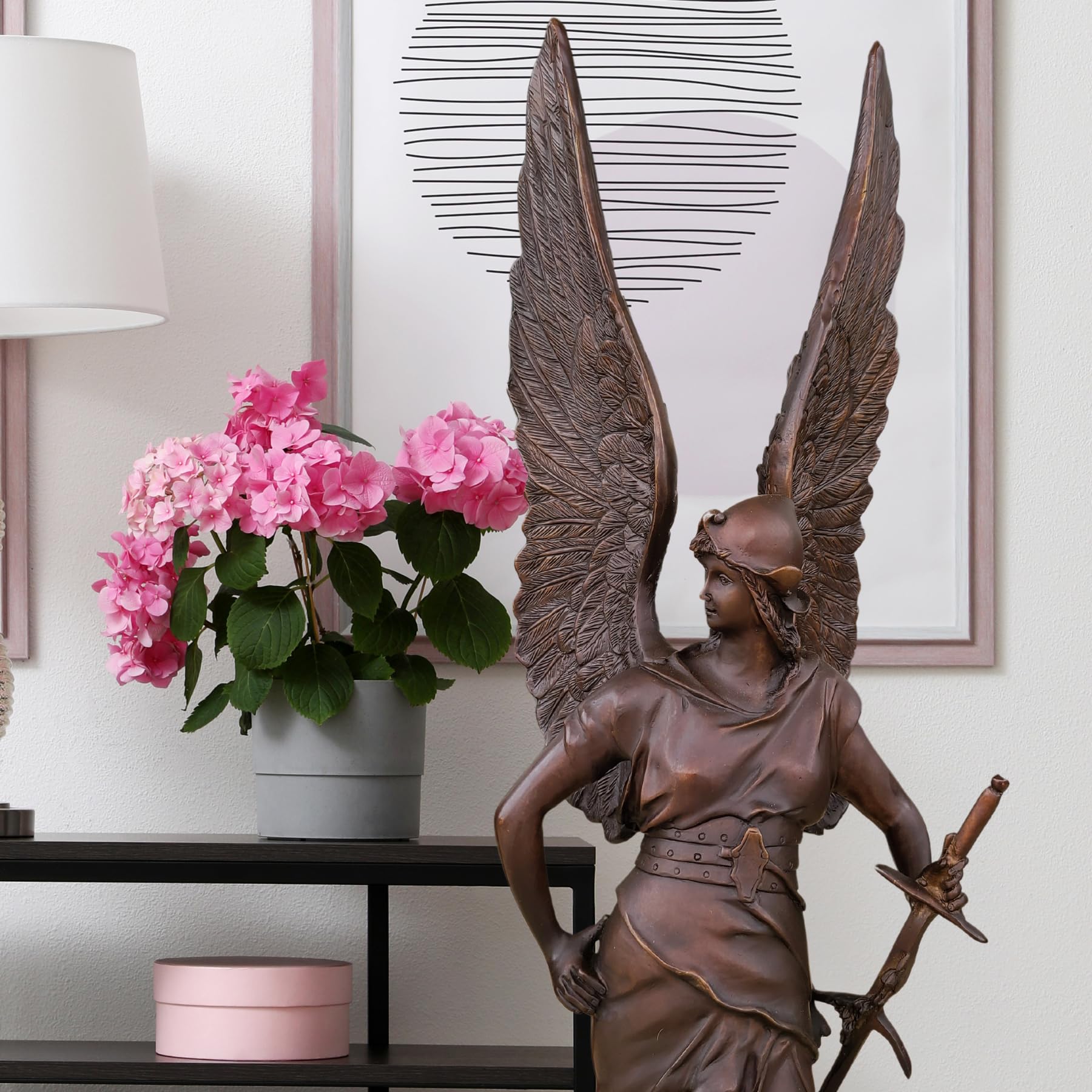 Bellona bronze winged war goddess sculpture styled with indoor plants as luxury home décor