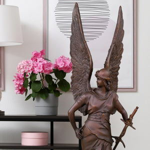 Bellona bronze winged war goddess sculpture styled with indoor plants as luxury home décor