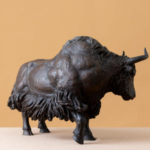 Close-up of the Giant black bison head and curved horns.