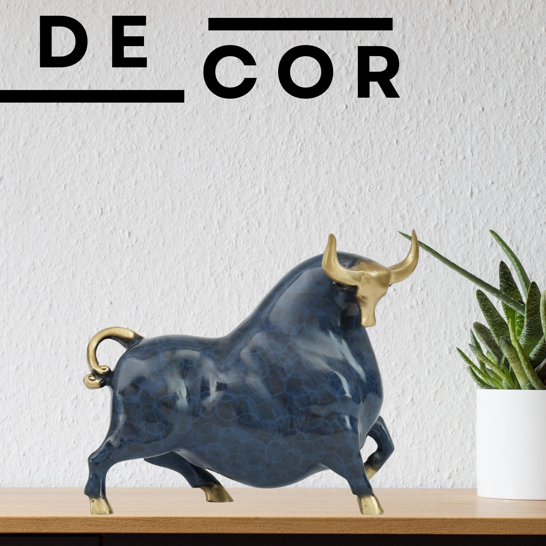Artistic blue bubble-pattern enamel glaze texture on brass bull statue.