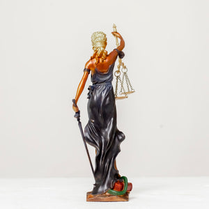 Blue teal Lady Justice Themis statue standing front view on white background with scales raised