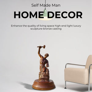 Pure bronze material detail of Bobbie Carlyle Self-Made Man statue beside fireplace setting