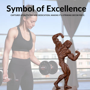 Bodybuilder bronze sculpture as symbol of excellence, displayed alongside fitness athlete for scale