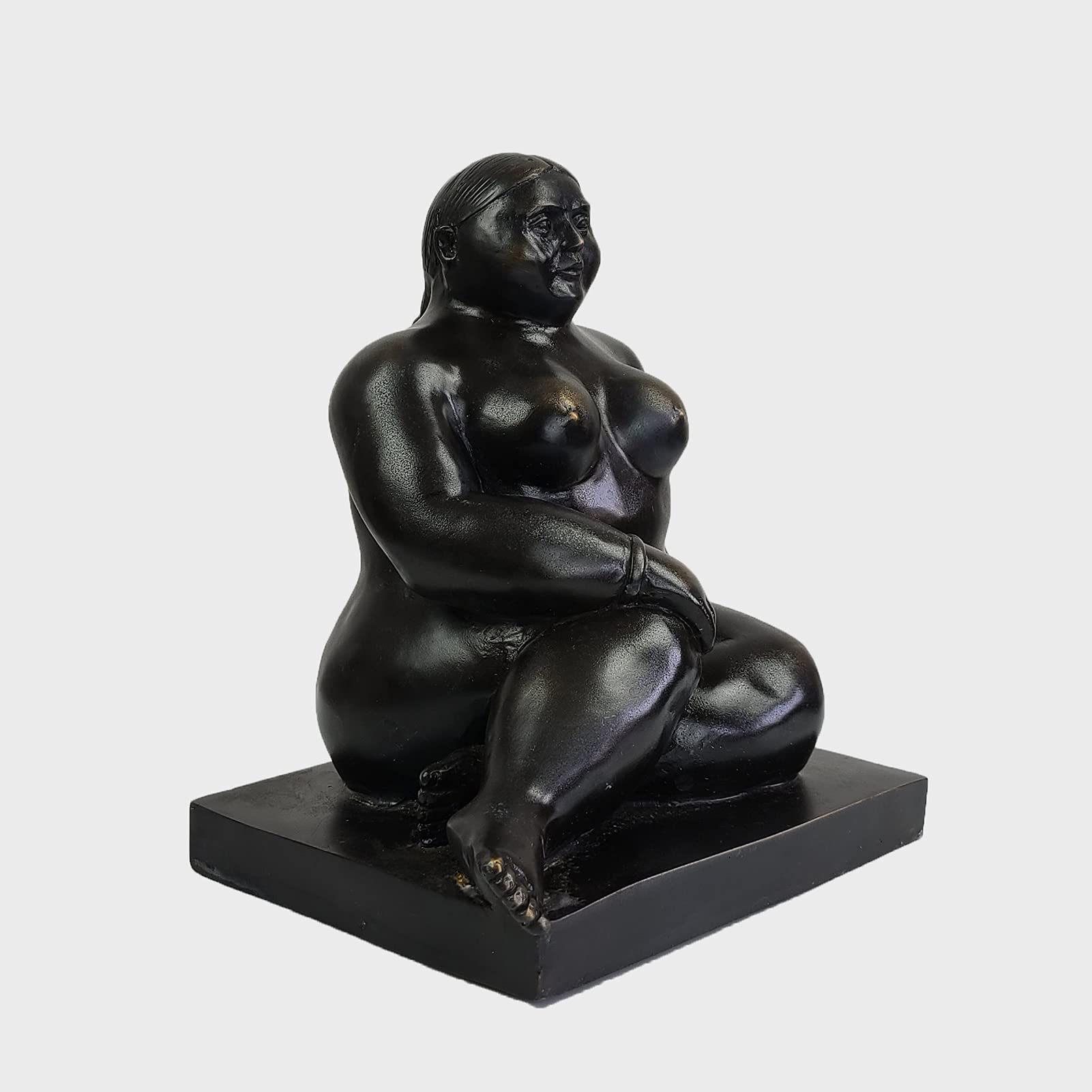 Botero bronze seated woman figurine front close up face and torso detail