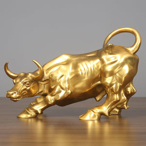 7.5-inch gold handcrafted brass charging bull statue, front view.