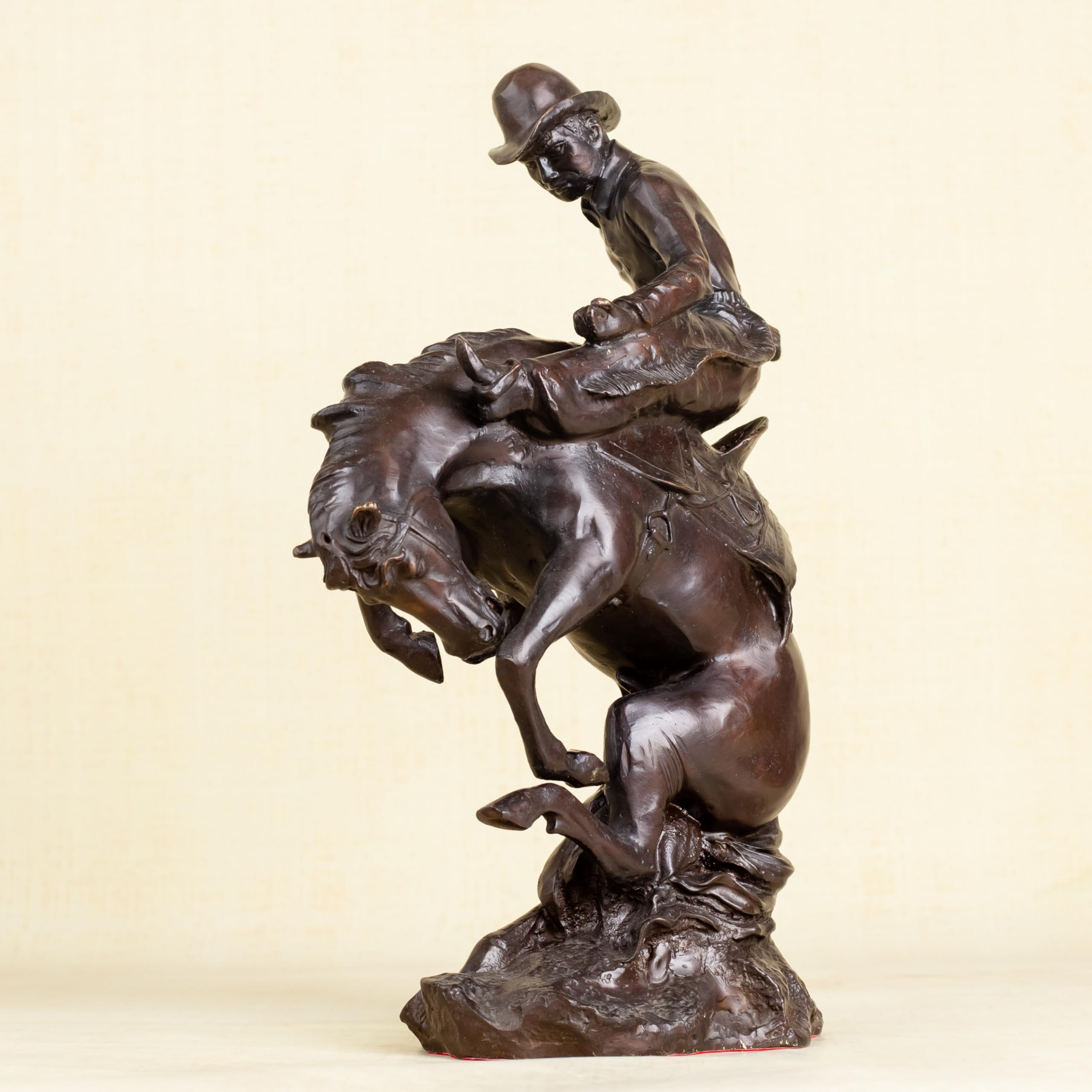 Left angle view of Style 3 Bronco Buster bronze cowboy taming wild horse