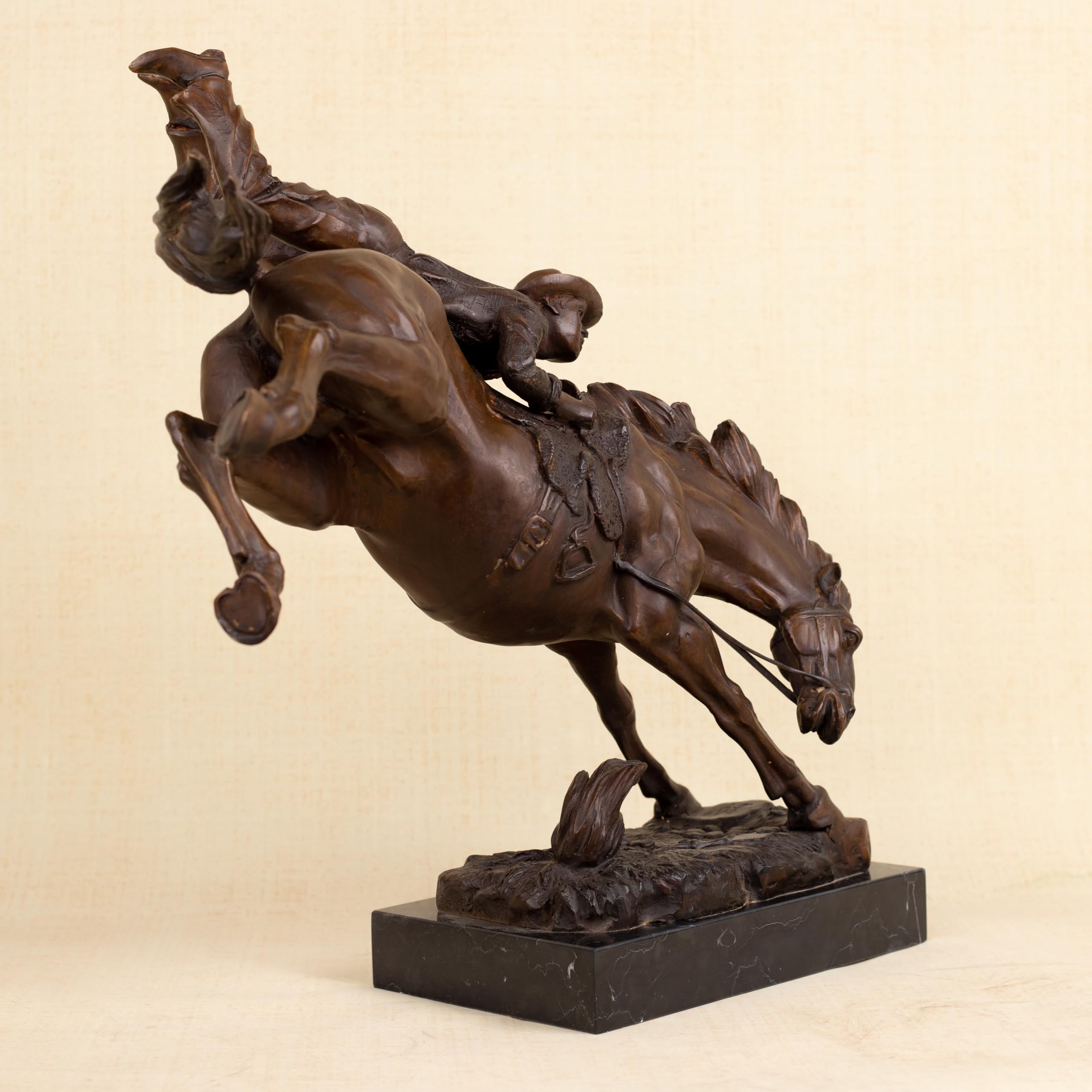 45-degree view of Frederic Remington large Bronco Buster bronze cowboy statue, warm brown patina