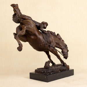 45-degree view of Frederic Remington large Bronco Buster bronze cowboy statue, warm brown patina