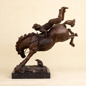 Angled view of large Bronco Buster Bucking Combat bronze statue, 14.5kg solid bronze on black marble