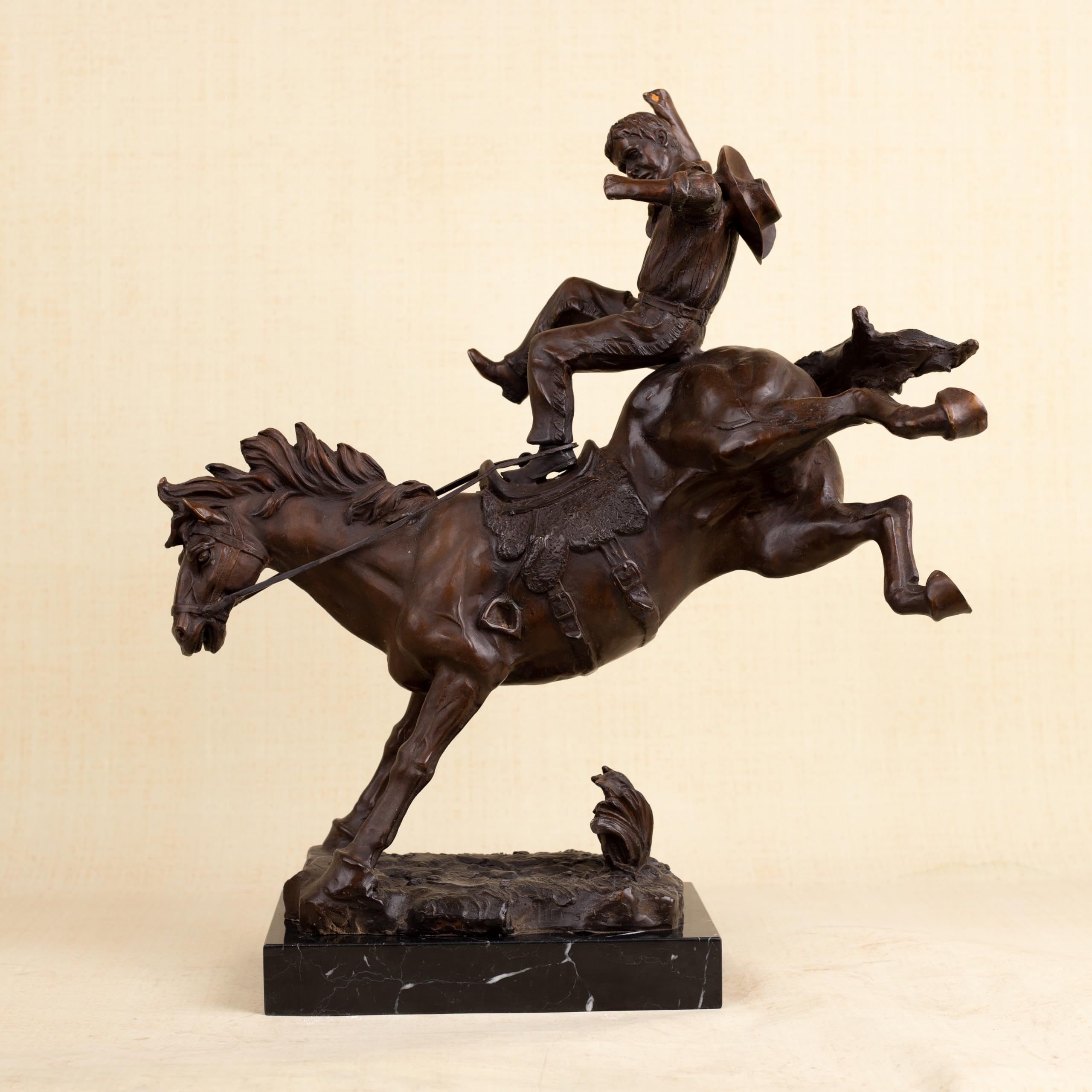 Full profile view of 19-inch large Bronco Buster solid bronze western sculpture on marble base