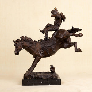Full profile view of 19-inch large Bronco Buster solid bronze western sculpture on marble base