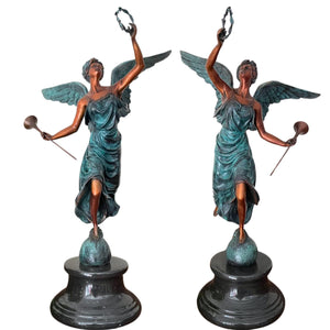 Pair of bronze angel statues trumpet laurel wreath verdigris patina front view both figures